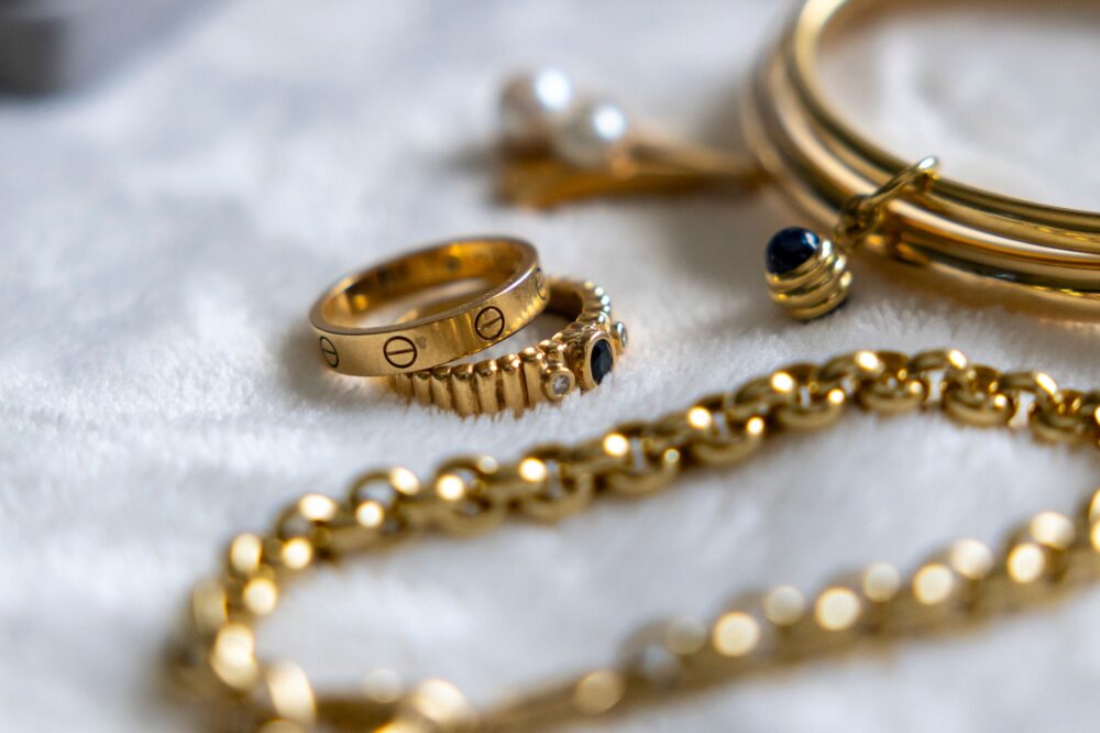 loans against jewellery Collection of gold rings, bracelets, and chains